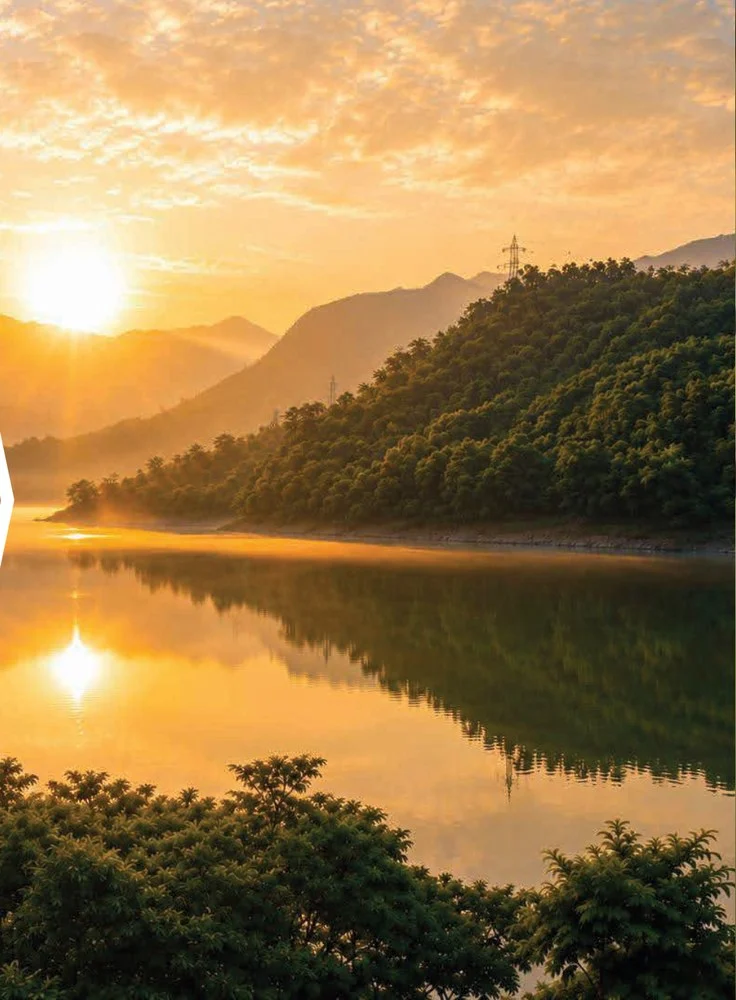 Peaceful mountain lake surrounded by green hills